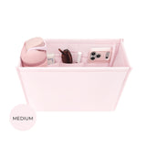 Ballet pink medium tote organizer insert with compartments holding sunglasses, phone, and cosmetics