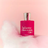 Juliette Has A Gun MMMM Eau de Parfum bottle on pink cloud background