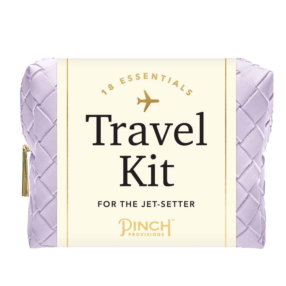 Travel kit with a purple pouch and white label on a white background