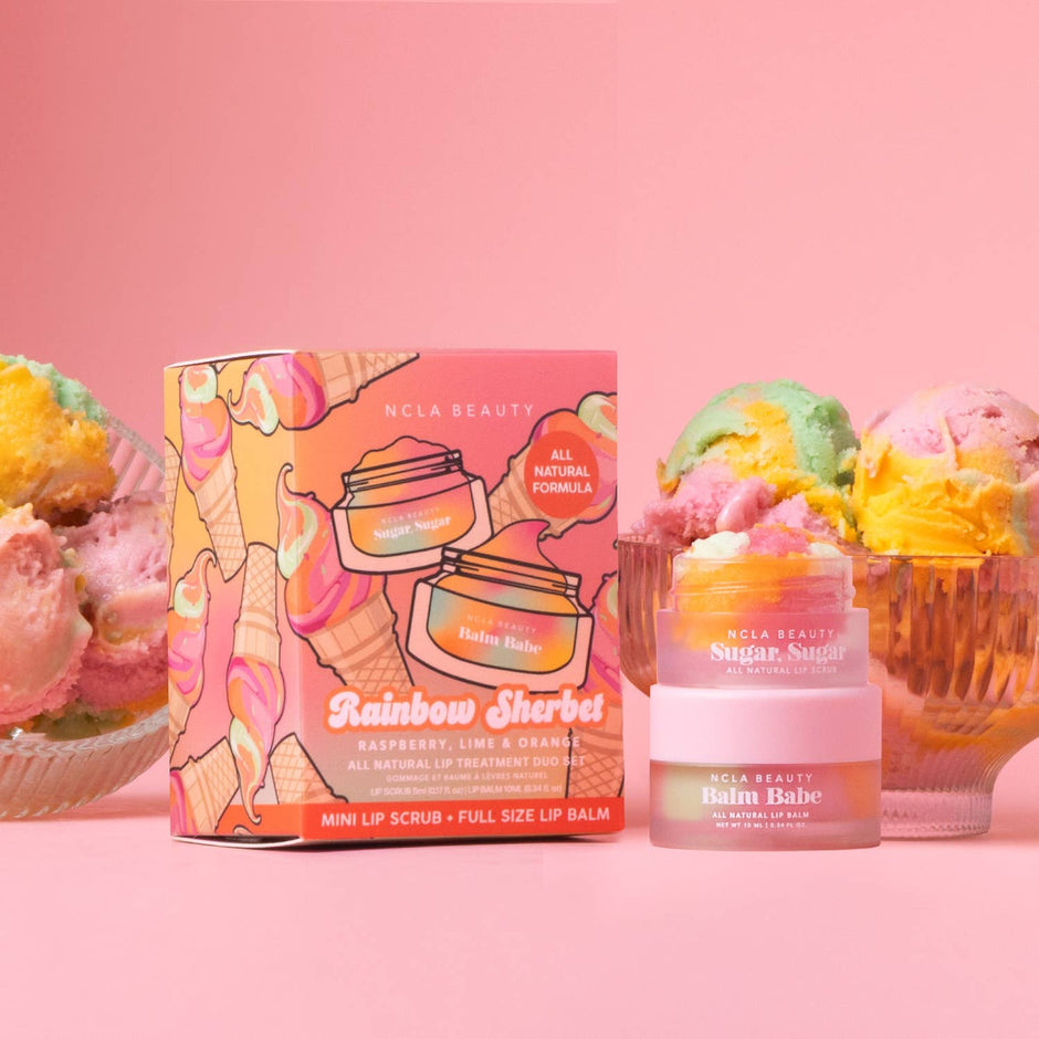 NCLA Beauty Rainbow Sherbet lip care set with ice cream props on pink background