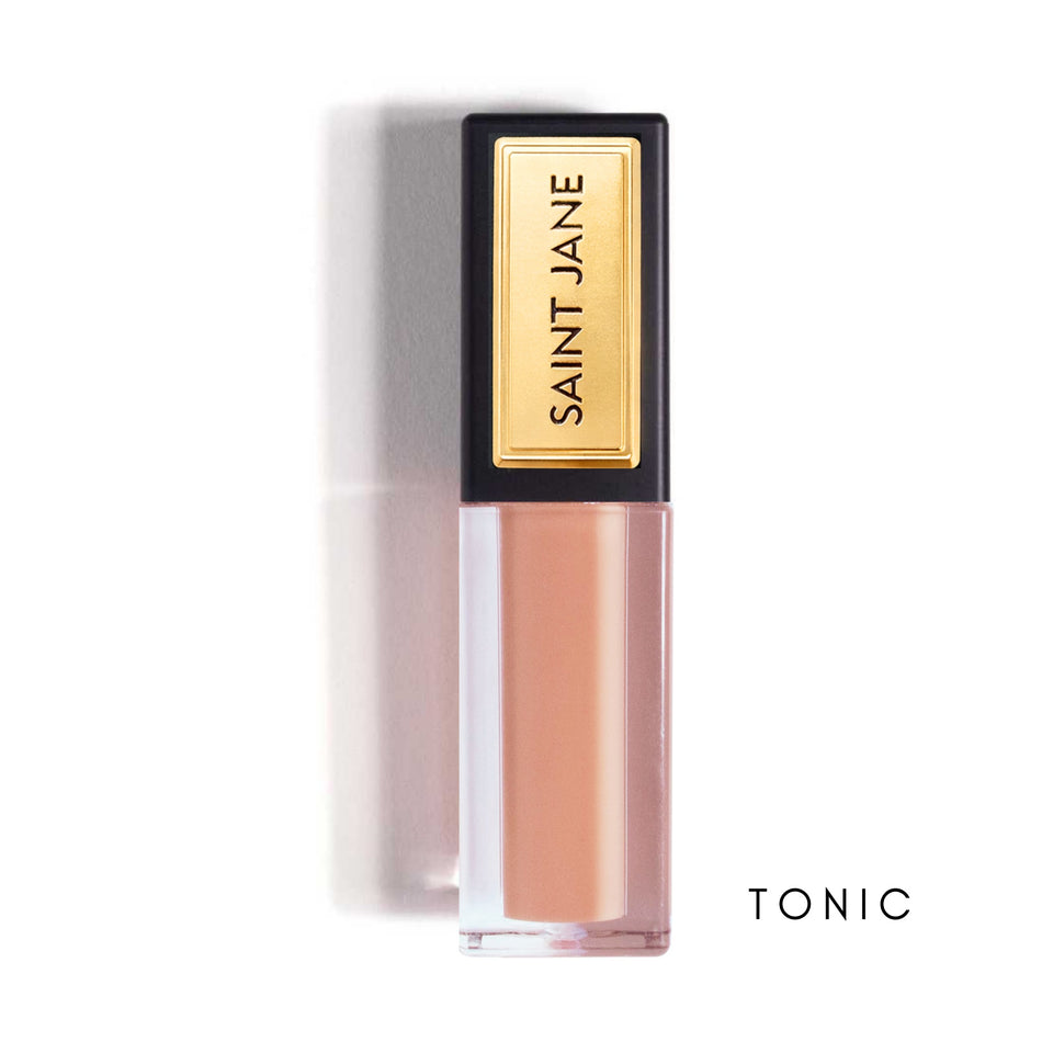 SAINT JANE Lip Shine in Tonic - nude pink liquid lipstick with gold and black packaging