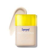 Supergoop! Protec(Tint) Daily SPF Tint with yellow cap on a white background