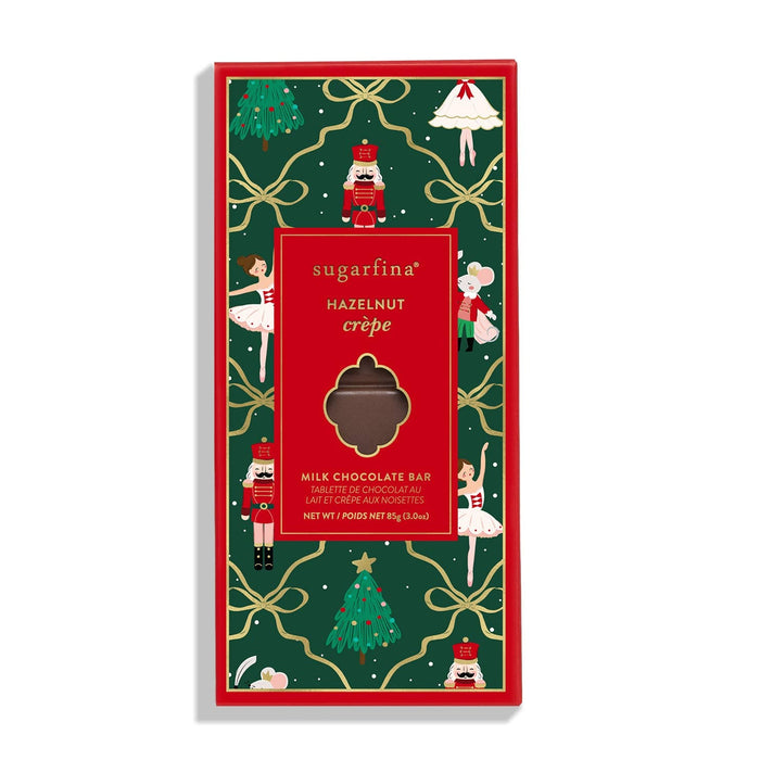 Sugarfina Hazelnut Crepe milk chocolate bar with festive green and red holiday packaging