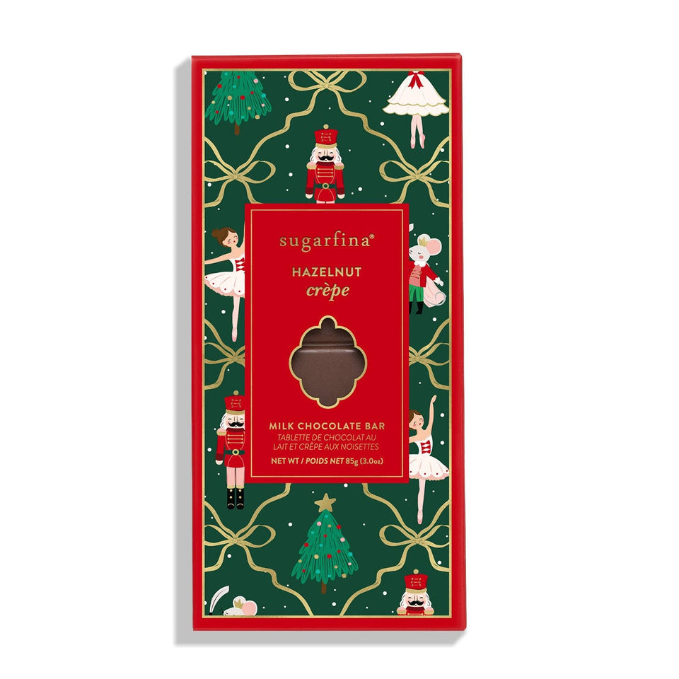 Sugarfina Hazelnut Crepe milk chocolate bar with festive green and red holiday packaging