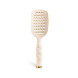 Tan vented hair brush with wavy paddle head and twisted handle on black background