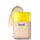 Supergoop! Protec(Tint) Daily SPF Tint with yellow cap on a white background