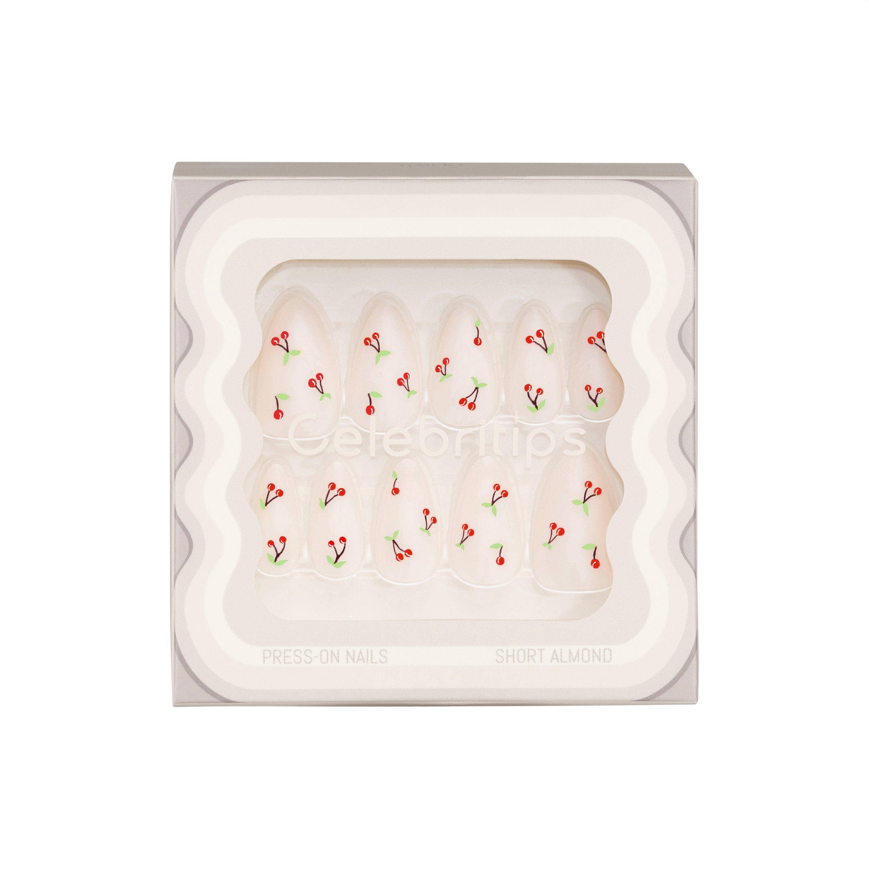 Nail art display with nail shapes and decorations on a white background