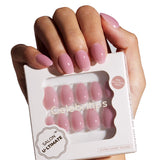 Hand holding a box of pink nail extensions with 'Celebritips' branding.