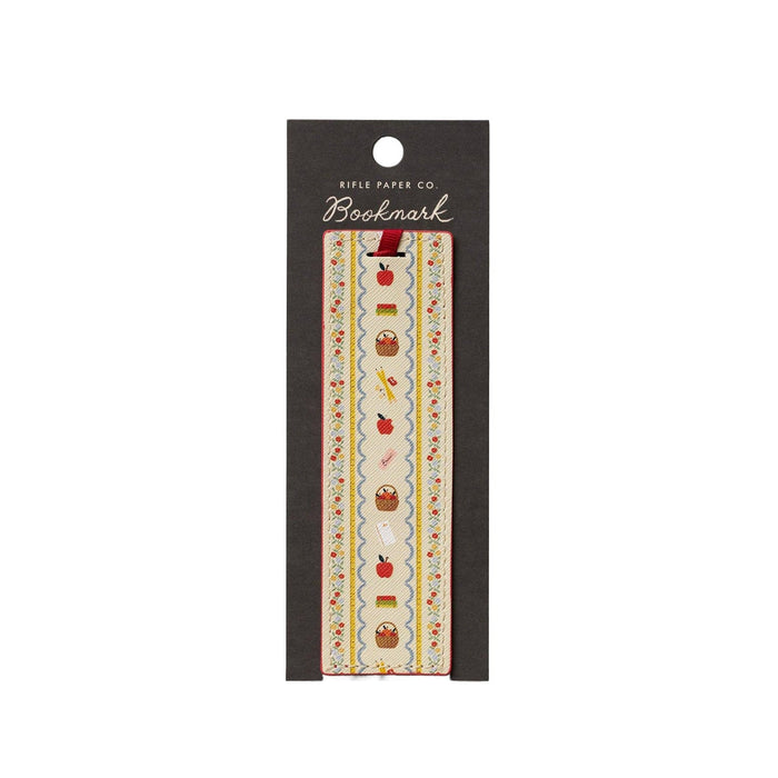 Rifle Paper Co. Schoolhouse bookmark with apple, basket, and pencil embroidered design on cream ribbon