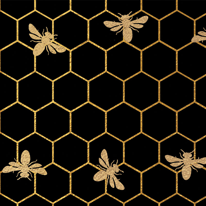gold bees and honeycomb on a black background