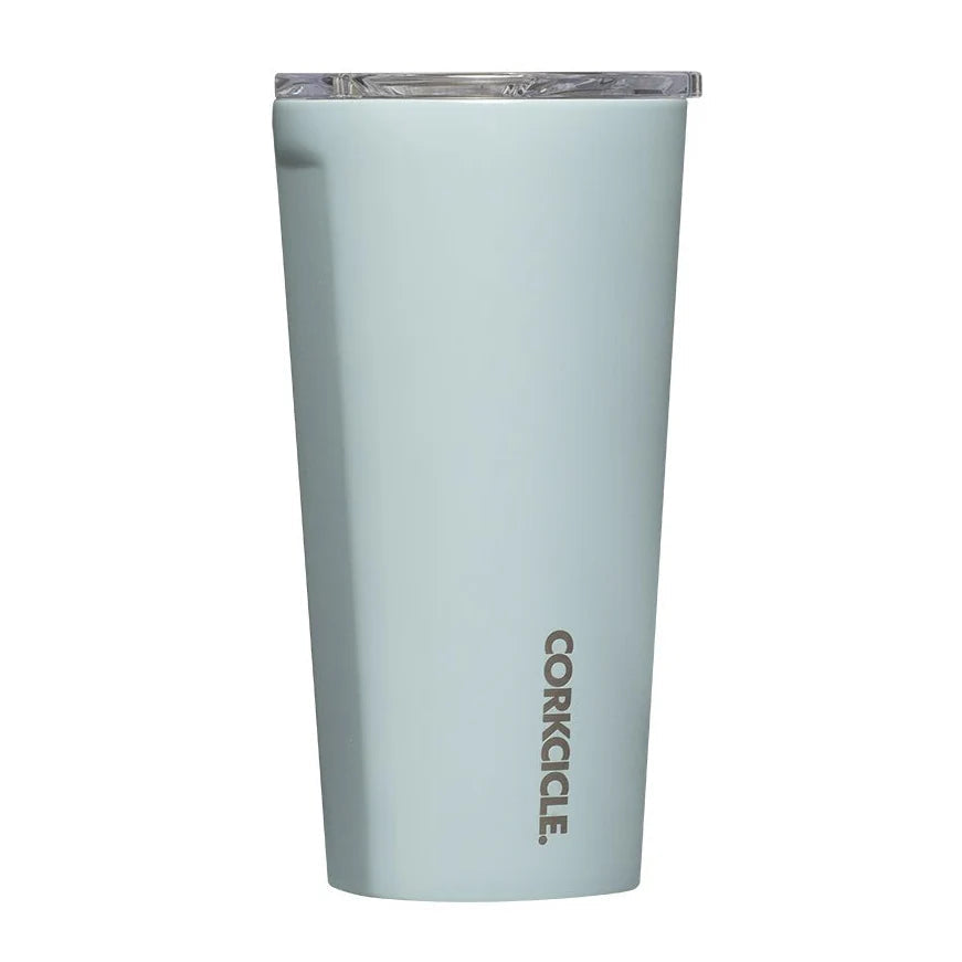 A light blue-gray Corkcicle tumbler with a clear lid, shown on a plain white background.
