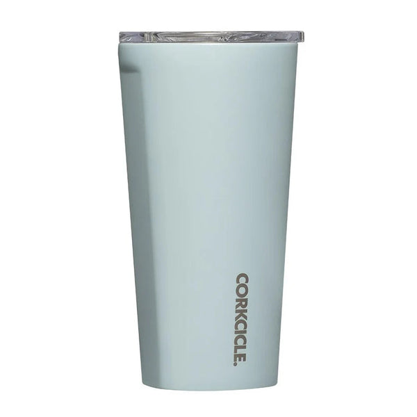 A light blue-gray Corkcicle tumbler with a clear lid, shown on a plain white background.