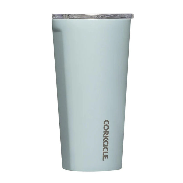 A light blue-gray Corkcicle tumbler with a clear lid, shown on a plain white background.