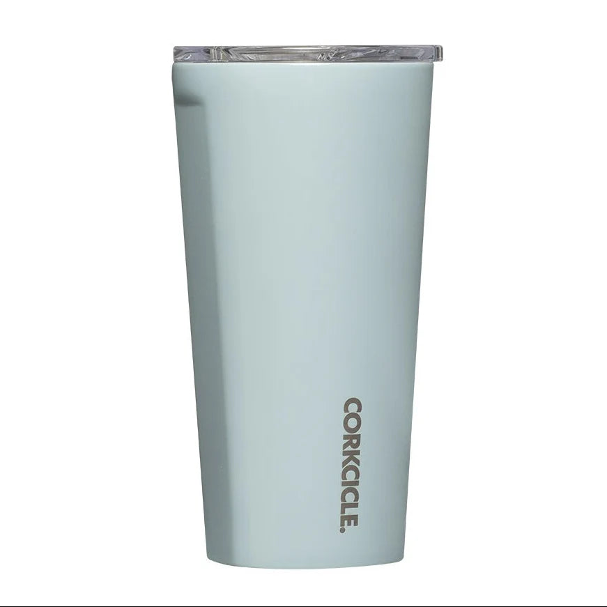 A light blue-gray Corkcicle tumbler with a clear lid, shown on a plain white background.