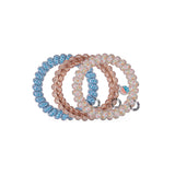 TELETIES Island Threads Large Hair Ties in blue, pink, and peach beaded styles on black background