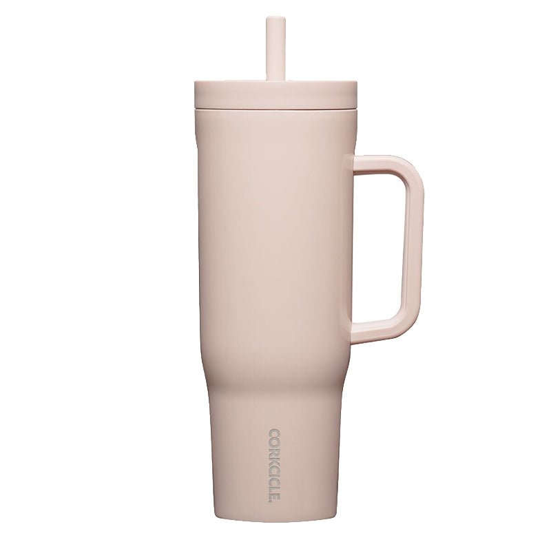 Pink insulated mug with handle and straw on a white background