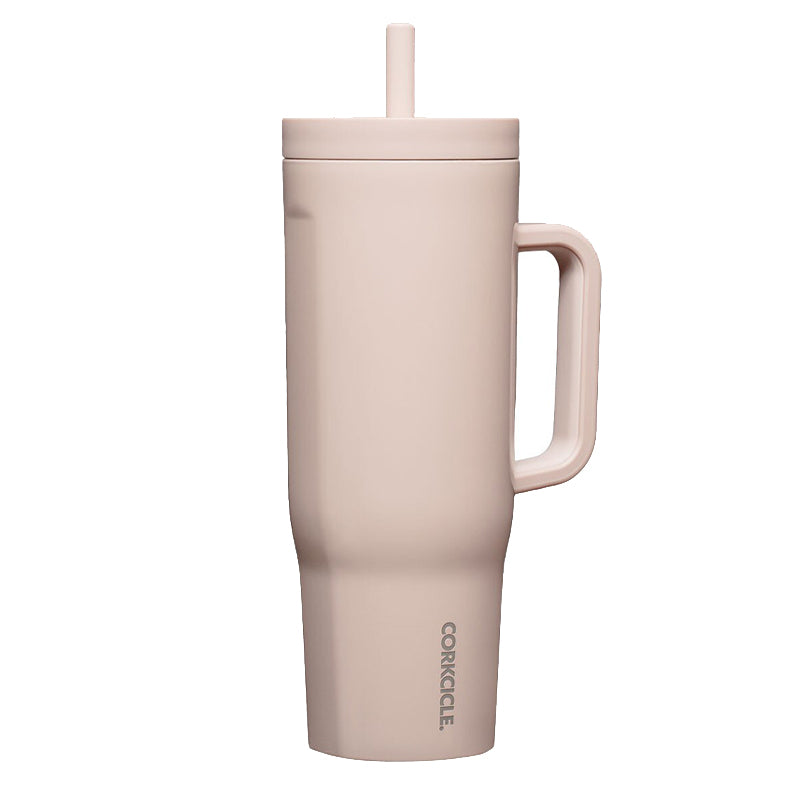 Pink tumbler with handle and straw on a white background