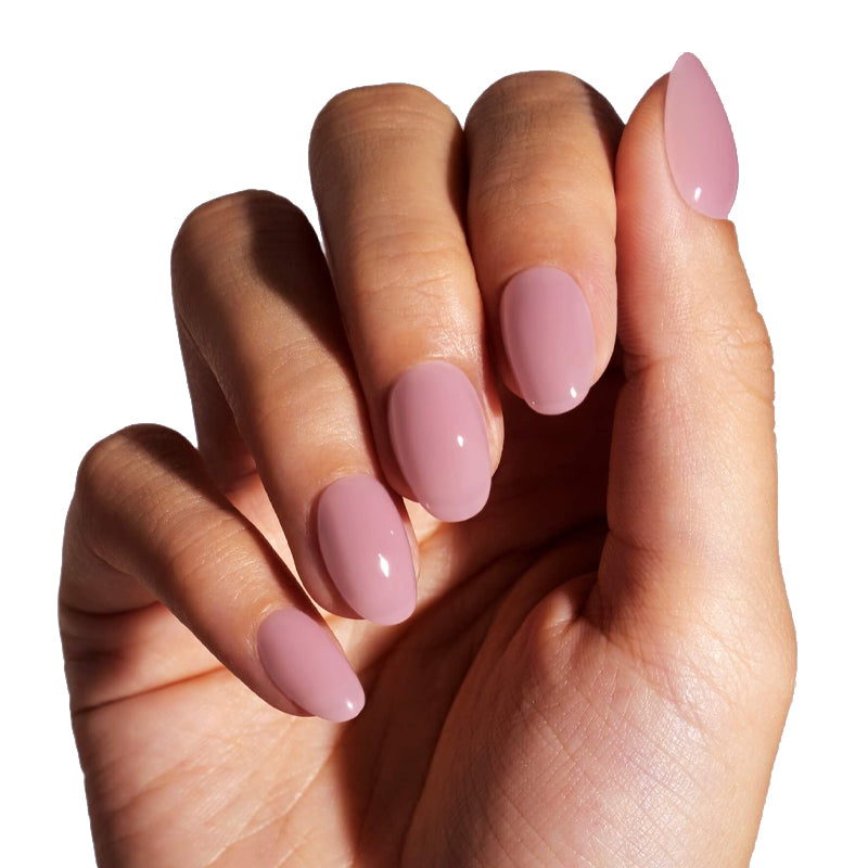 Hand with pink nail polish on a white background