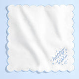 White scalloped handkerchief with blue 'happy tears' embroidery and heart detail