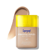 Supergoop! Protec(Tint) Daily SPF Tint with yellow cap on a white background
