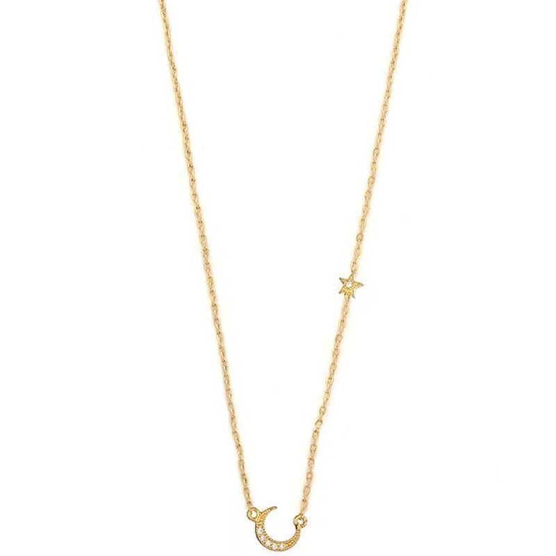 Gold pave moon and star pendant necklace on delicate chain against white background