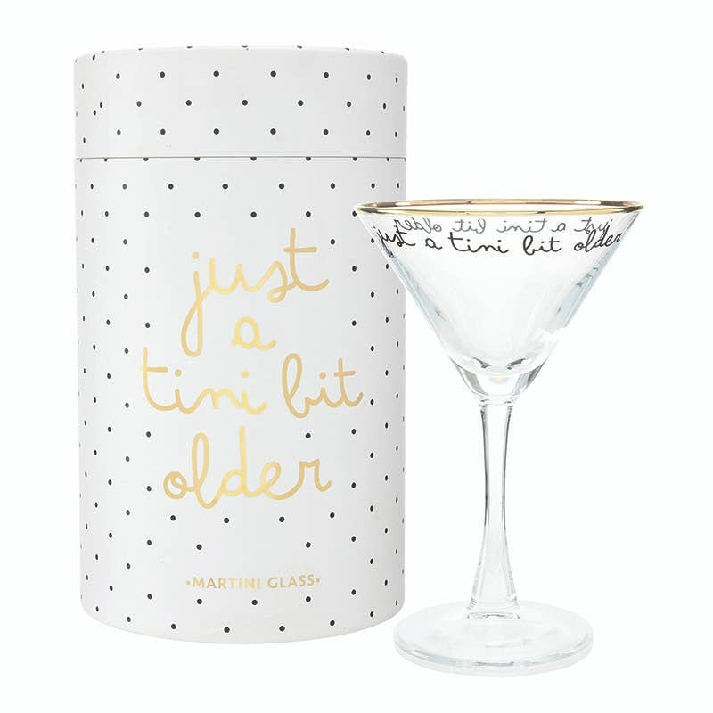 Gold foil martini glass with 'Just a Tini Bit Older' text and polka dot gift box packaging