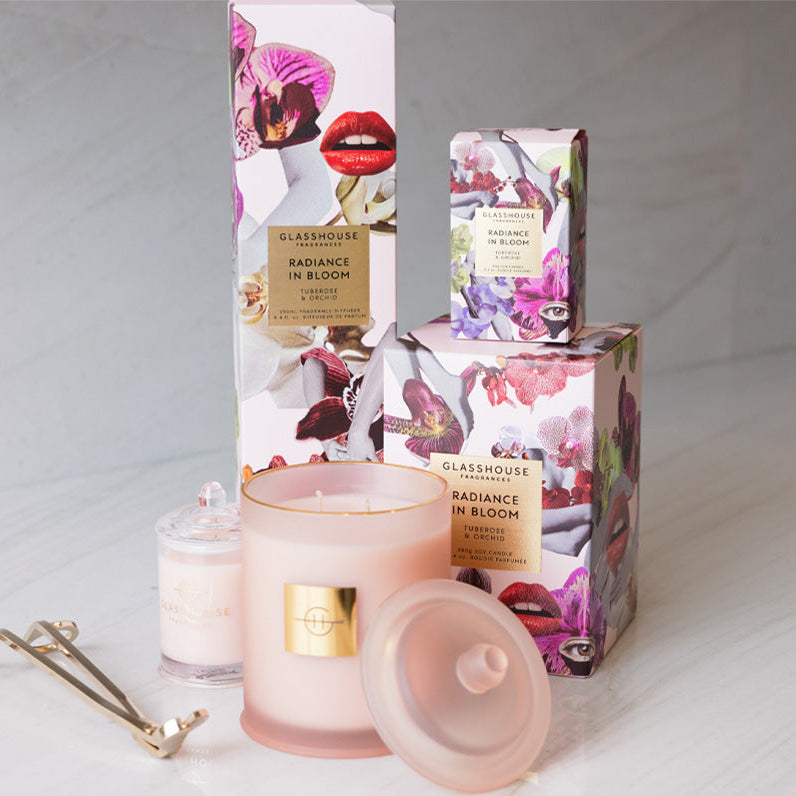 Glasshouse Fragrances candle and packaging on a light background