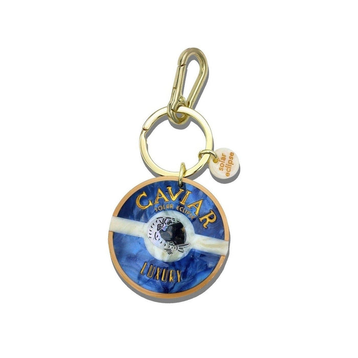 Solar Eclipse hand-painted caviar bag charm keychain with blue enamel design and gold-tone hardware