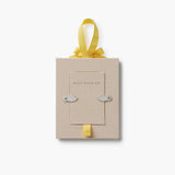 Rifle Paper Co. baby's first Christmas picture frame ornament with yellow ribbon on white background