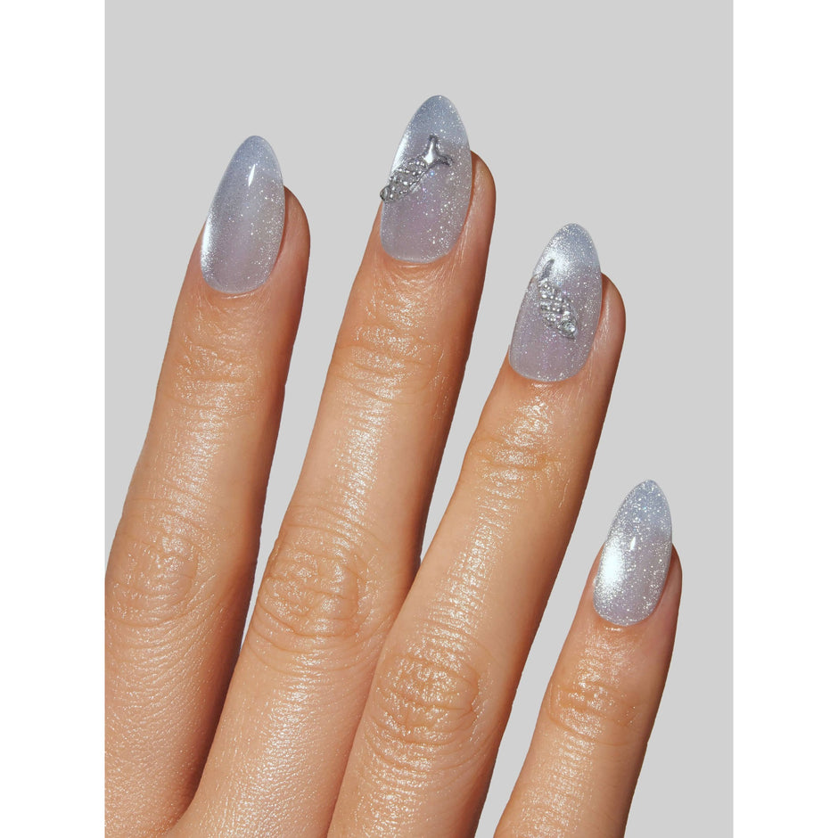Sea Salt glitter nail polish swatches on model fingernails showcasing sparkly silver finish