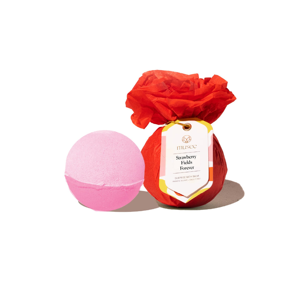 Musee Strawberry Fields Forever pink bath balm with red rose-shaped packaging on white background