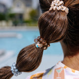 TELETIES Island Threads Large Hair Ties worn in braided pigtails by pool