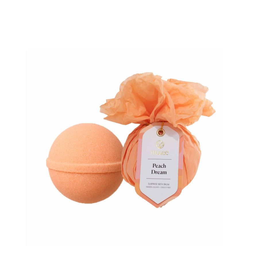MUSEE Peach Dream bath balm sphere in peachy-orange with organza packaging and label tag