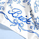 White bride hair scarf with blue floral and ribbon print design for weddings and bachelorette parties