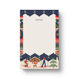 Rifle Paper Co. Ski Chalet Holiday Notepad with festive winter knit pattern border and skiers illustration