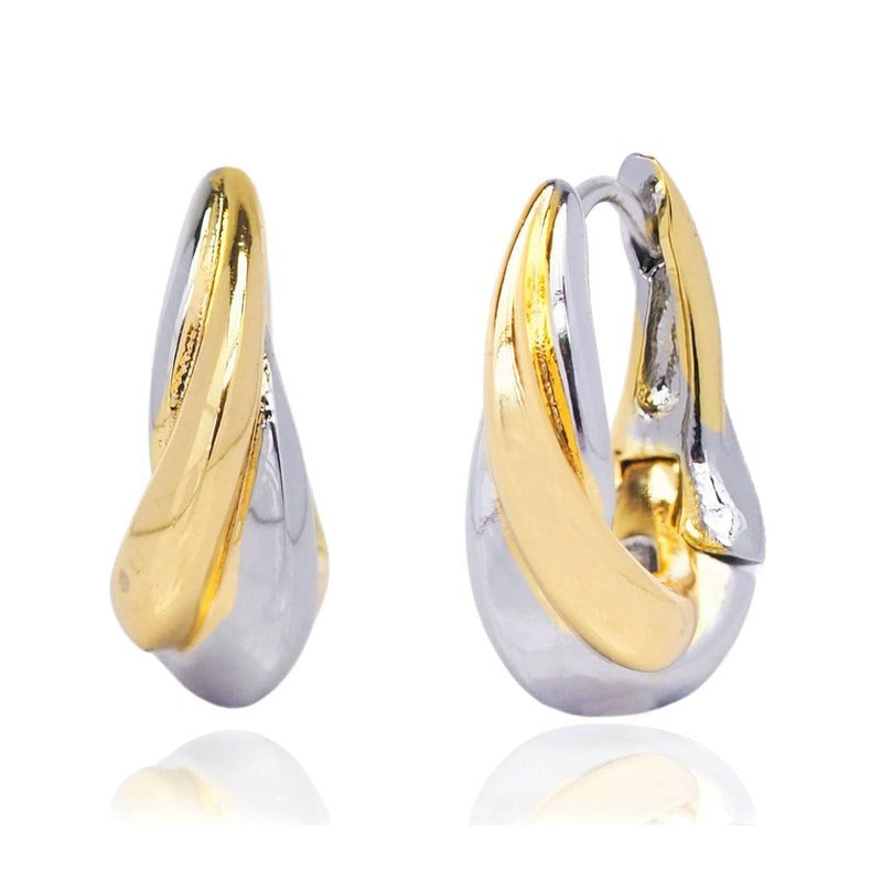 Two-tone gold and silver medium drop huggie earrings with polished finish on white background