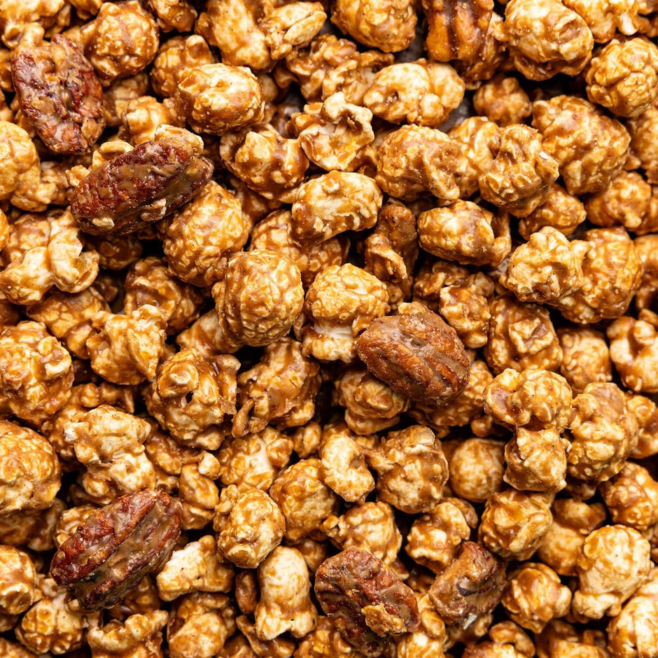 Cinnamon Bourbon Pecan Popcorn - caramel-coated popcorn with pecans close-up view
