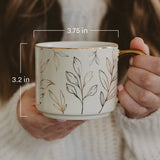 Ceramic coffee mug with leaf pattern showing 3.75 in width and 3.2 in height measurements