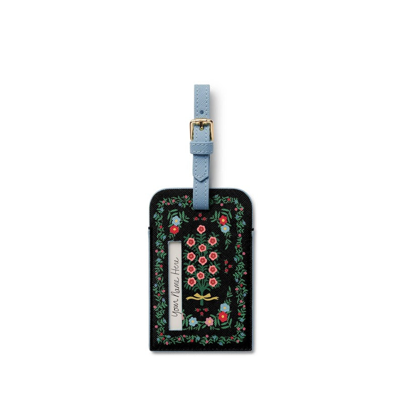 Rifle Paper Co. Rosette black floral luggage tag with light blue leather strap and gold buckle