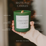 Christmas Cookies 15oz soy candle with feature callouts highlighting premium fragrance oil, cotton wick, and non-toxic ingredients