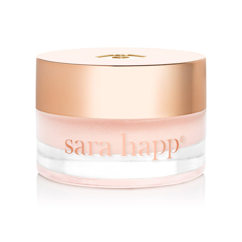 Jar of sara happ lip balm with a gold lid on a white background