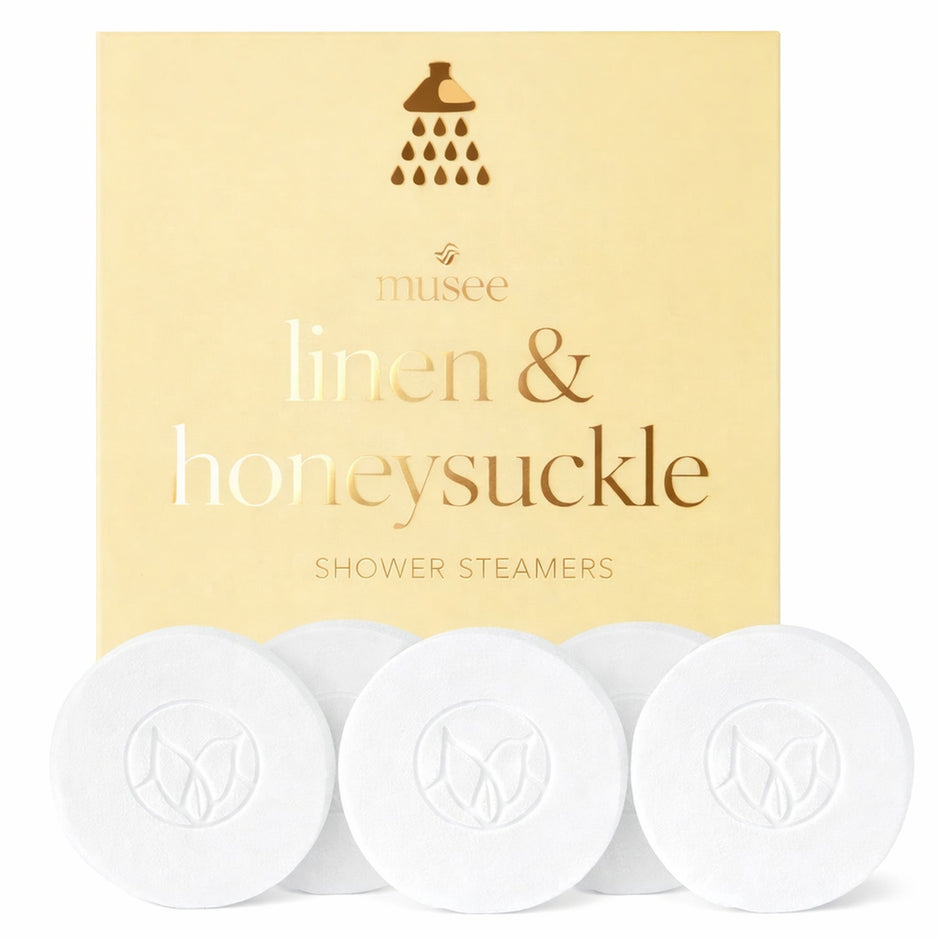 Musee Linen & Honeysuckle Shower Steamers product packaging with three white aromatherapy steamers