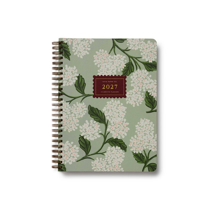 Floral patterned notebook with '2027' on a white background