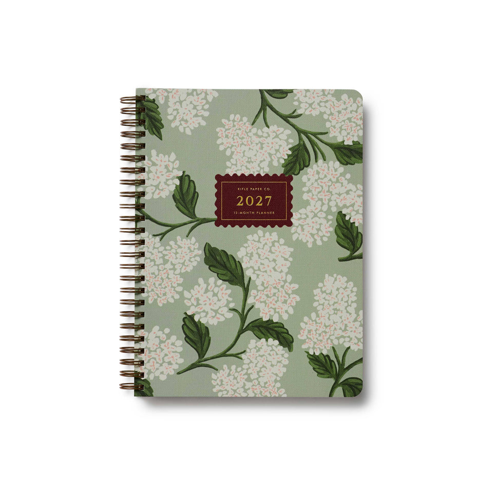 Floral patterned notebook with '2027' on a white background