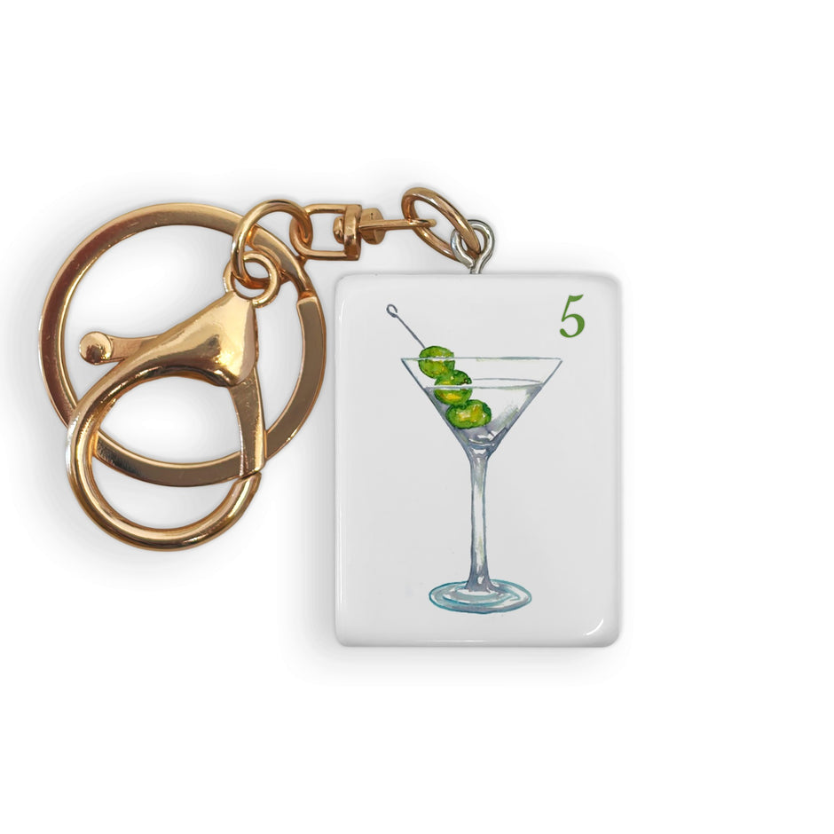 Gold Mahjong tile keychain with martini card charm featuring olive cocktail illustration