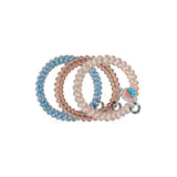 TELETIES Island Threads Small Hair Ties in blue, pink, and neutral tones displayed together