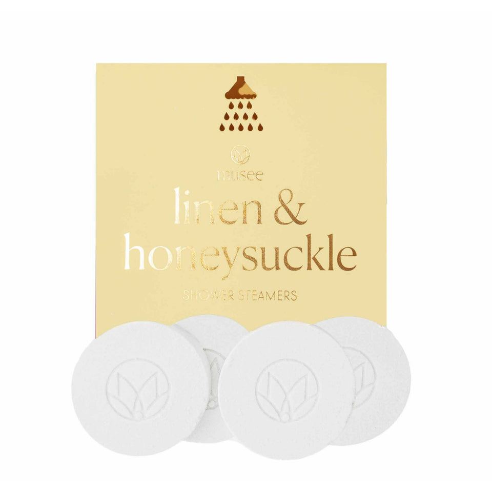 Musee Linen & Honeysuckle shower steamers product packaging with three white circular steamers displayed