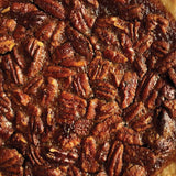 Close-up of a pecan pie topped with whole pecans