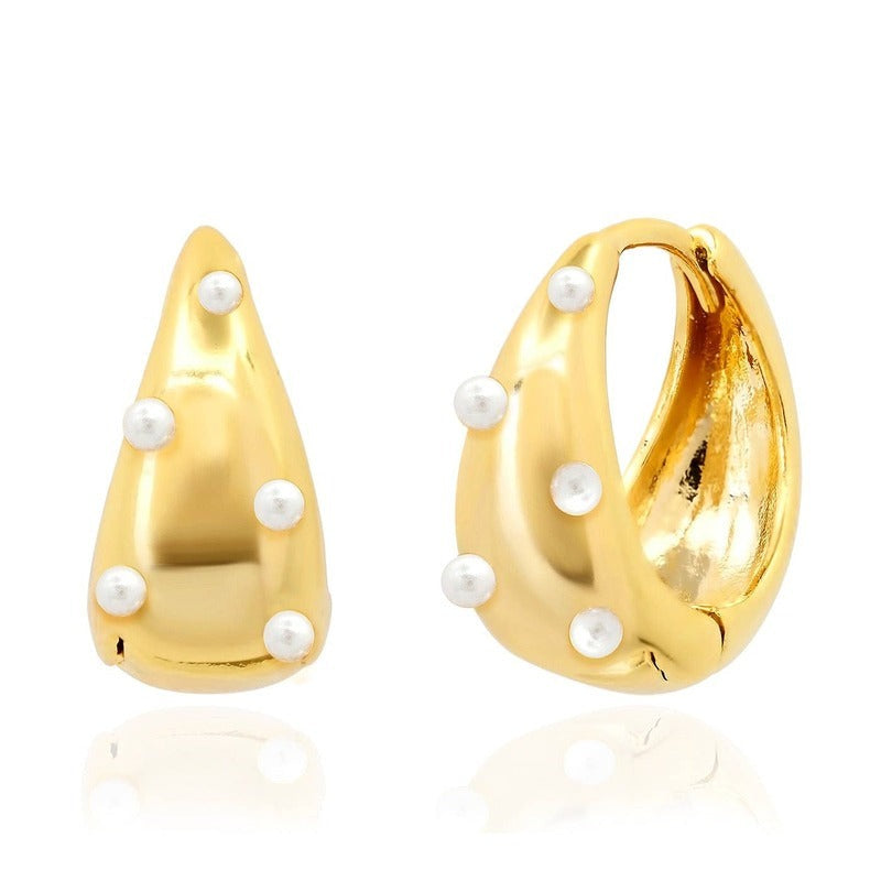 Gold teardrop pearl click huggie earrings shown front and side view on white background