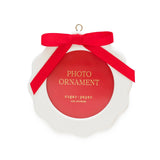 Red and white circular photo ornament with red ribbon bow by Sugar Paper Los Angeles